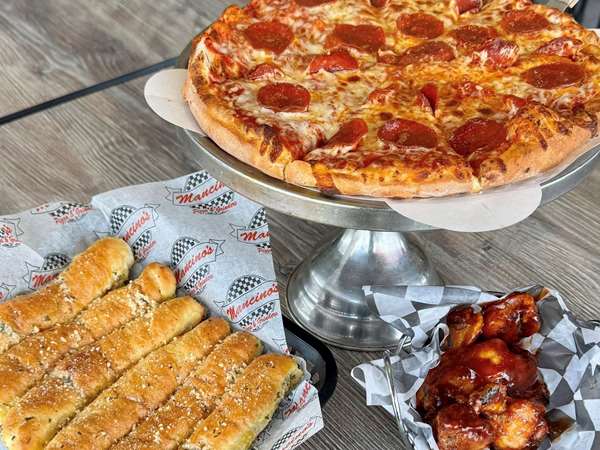 Pepperoni pizza, chicken wings and bread sticks from Mancino's. 